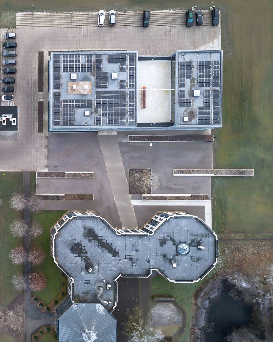 Drone view of the KEMPER company premises with production buildings, parking areas and a truck