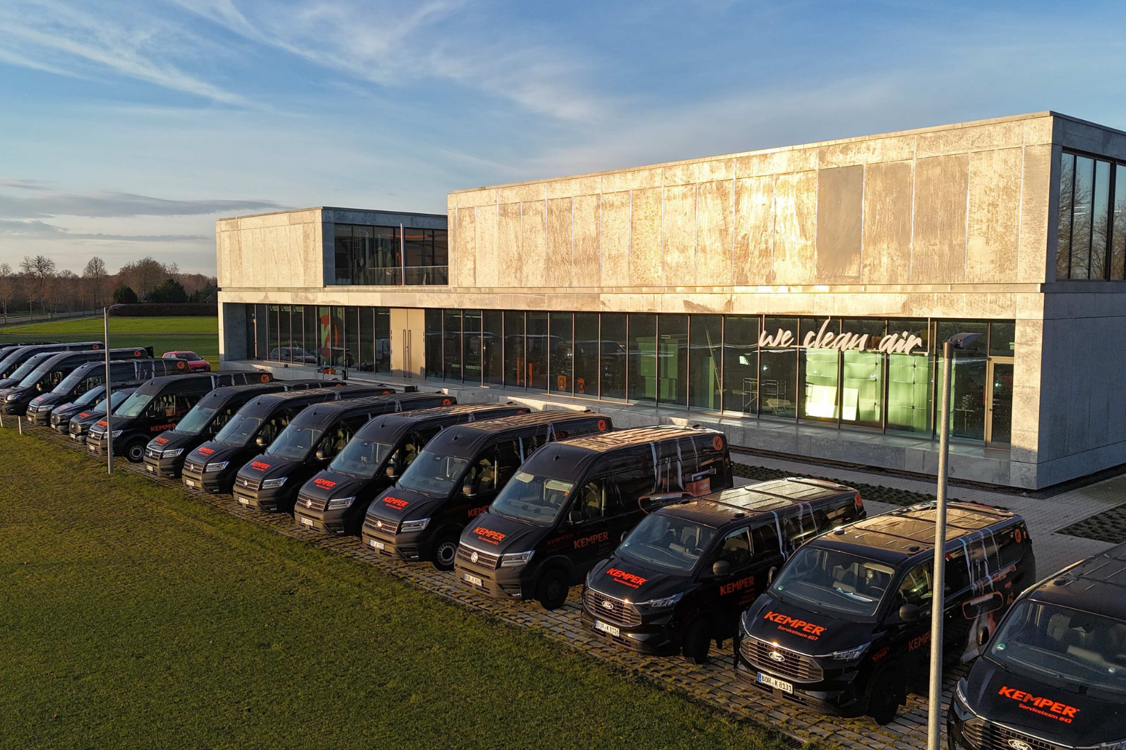 KEMPER service vehicles in front of the headquarters representing readiness and customer service